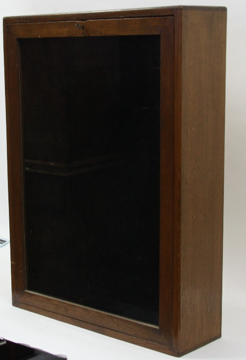 An oak glazed display cupboard with fall front, 54cm (21.25") wide