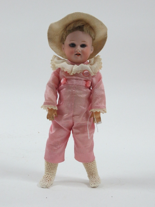 An Armand Marseille small bisque head doll, the head impressed Armand Marseille 390 DRGM 25A8/0,