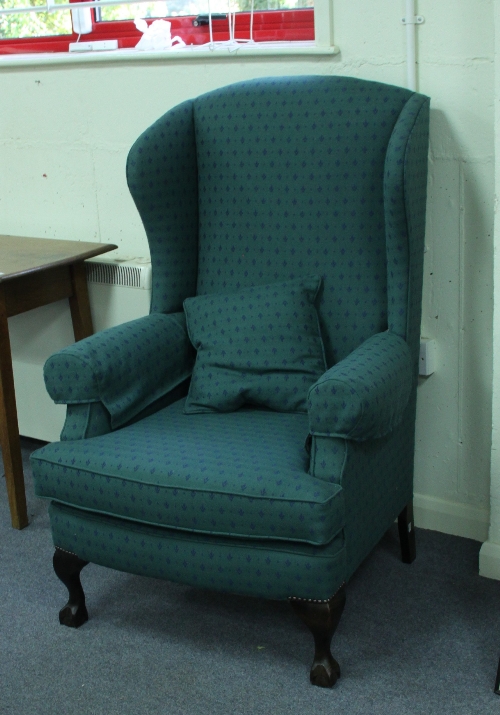 A George II style long wing armchair on cabriole legs with claw and ball feet, S. Rouse & Co.