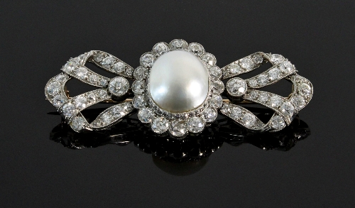A Victorian diamond and natural blister pearl brooch of bow form, the central pearl and diamond