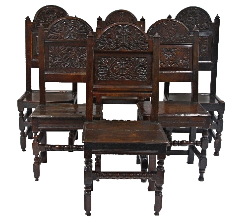 A composite set of six 17th Century English carved panel back chairs, possibly Lancashire circa