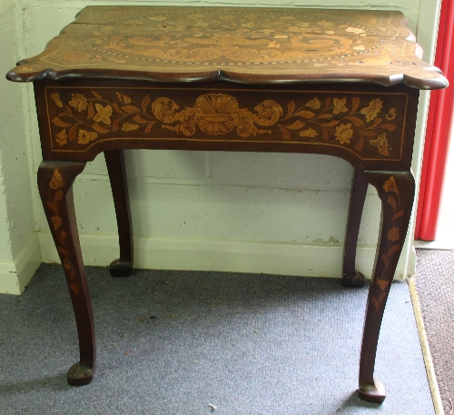 A 19th Century Dutch marquetry side table, the shaped top with oval marquetry panel on cabriole legs