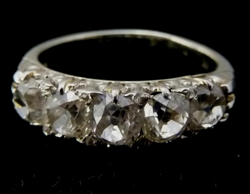 A Victorian diamond five-stone ring, in a scroll setting, the shank marked 18ct Plat and dated 6