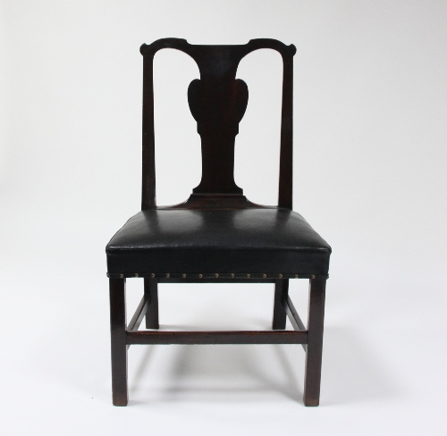 A George II red walnut dining chair with vase shaped splat and leather stuff-over seat, on square