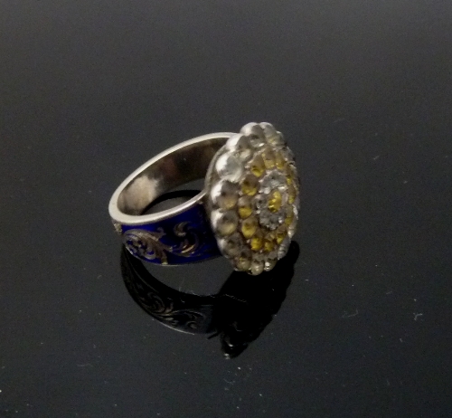 A novelty locket ring, the paste set cluster to an enamelled shank