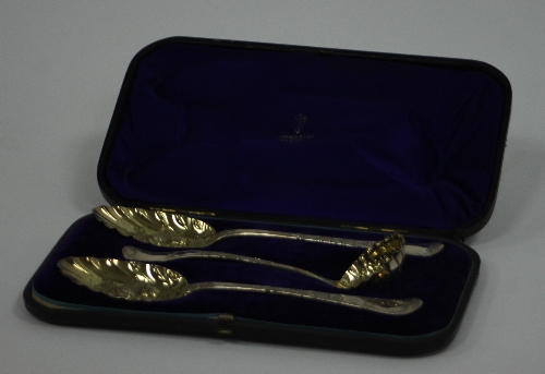 A matched set of Georgian silver berry spoons, comprising two spoons and a sifter spoon, cased