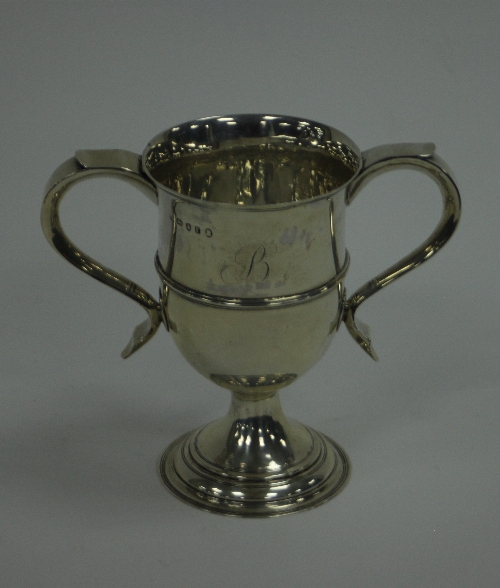 A George III silver two-handled cup, Peter & Ann Bateman, London 1792, initialled B, on a circular