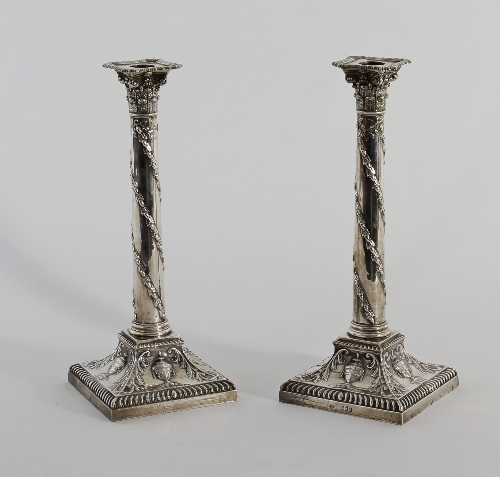 A pair of Adam style silver candlesticks, Goldsmiths and Silversmiths Co, of Corinthian column