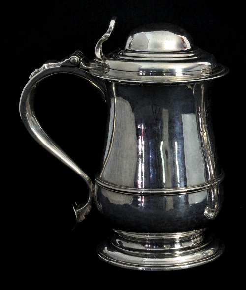 A George III silver tankard, Francis Crump, London 1764, of bellied form with domed cover, scroll