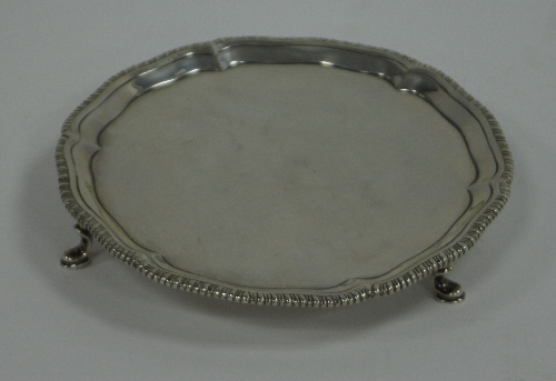 A George III silver card waiter, Richard Rugg, London 1771, with pie crust border and gadrooned