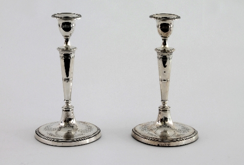 A pair of George III silver candlesticks, John Parsons & Co, Sheffield 1789, of Adam style with