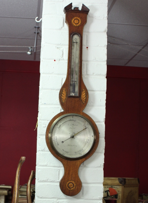 A 19th Century wheel barometer, the case with architectural pediment and later inlays, the