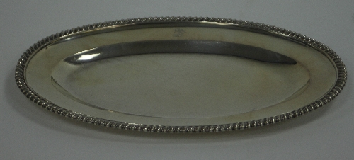 A William IV silver dish, Sebastian Crespell II, London 1837, oval with gadrooned border, crested,