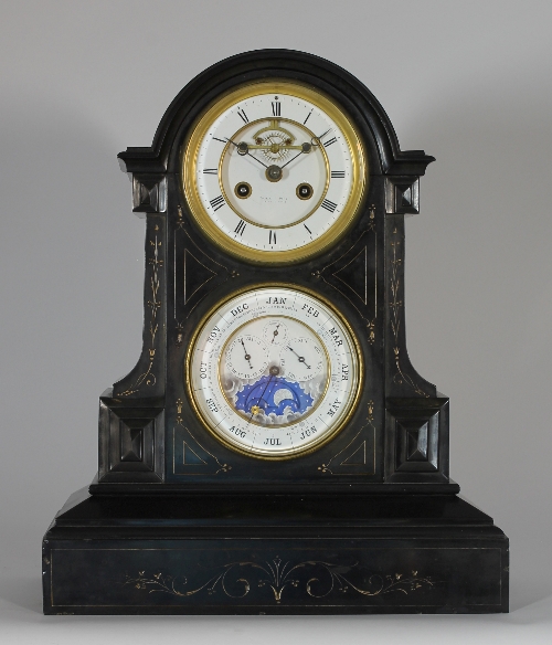 A black marble calendar clock, the case with incised decoration, the clock with white enamelled dial