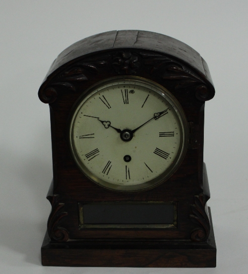 A William IV rosewood mantel time piece with circular painted dial, 28cm (11") high