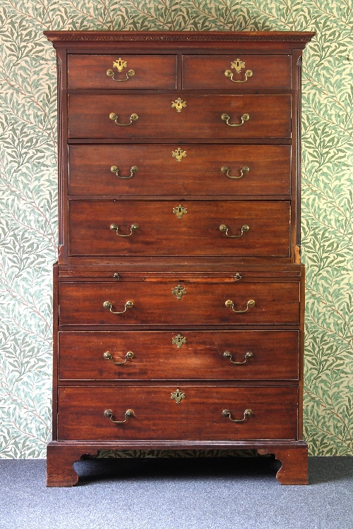 An 18th Century mahogany tallboy chest, the top with dentil moulded cornice, fitted three long and