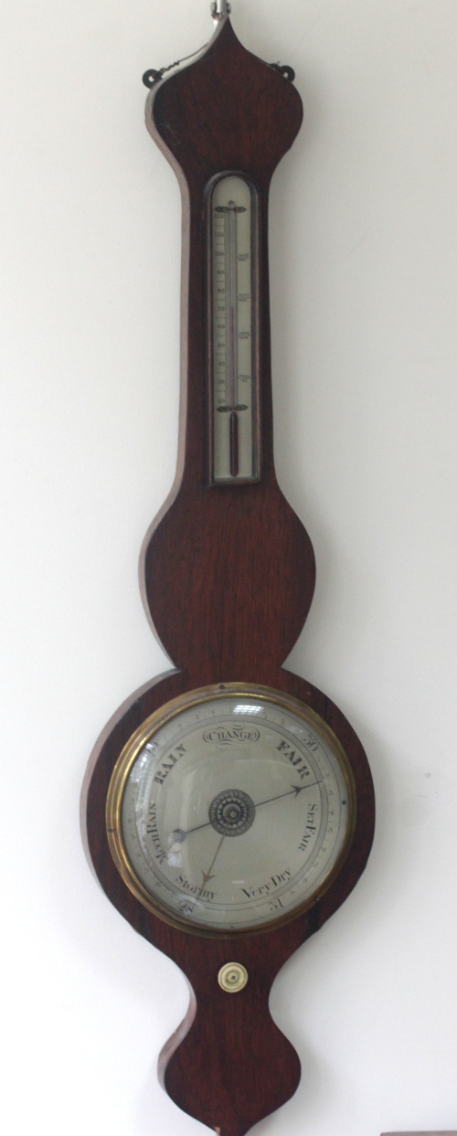 A rosewood barometer and thermometer in a banjo shaped case, 94cm (37") high/Provenance: Holcombe