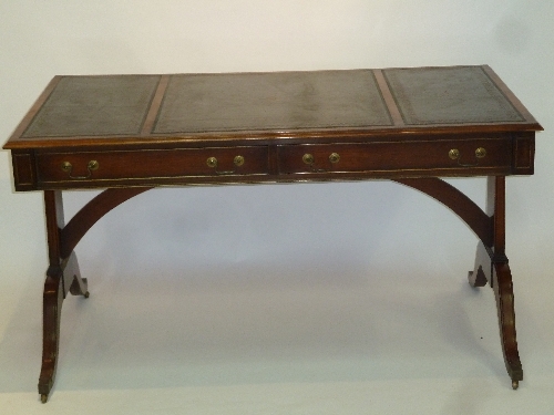 A George III style writing table, 140cm (55") wide