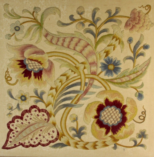 A needlework panel depicting foliate scrolls, in a wooden frame, the panel 60cm x 60cm (23.5" x 23.