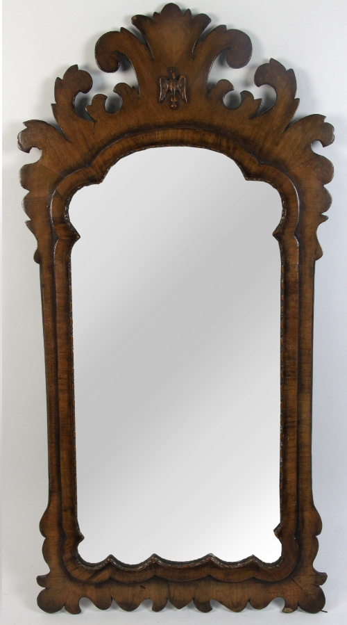 A George II style walnut framed fret carved wall mirror