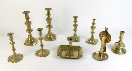 A pair of 18th Century brass candlesticks, 20.25cm (8") high, two 19th Century pairs, a chamber
