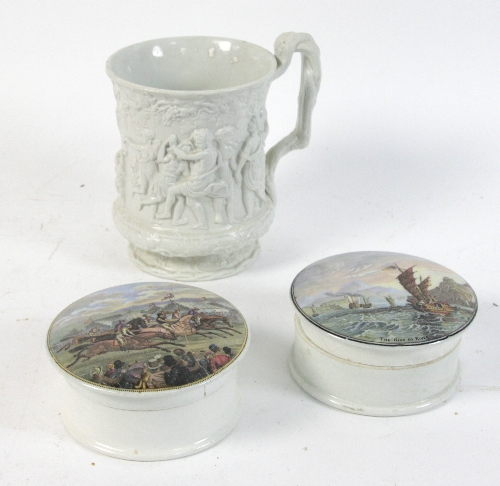 A Charles Meigh relief moulded mug, decorated a bacchanal scene, and two potlids