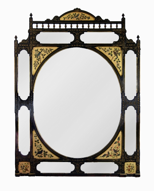 An Aesthetic movement wall mirror, the central oval glass with eight smaller plates to the frame all