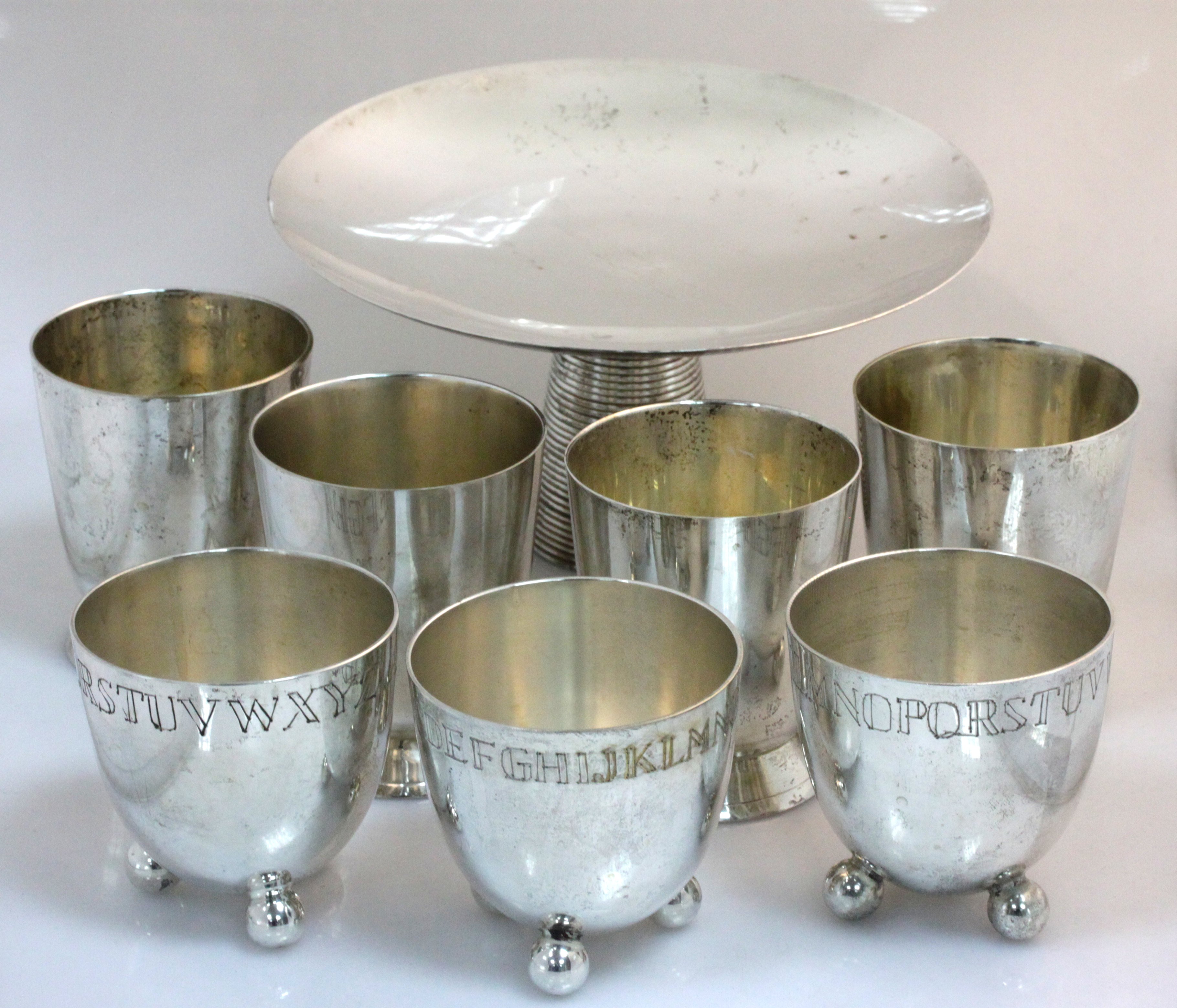 A set of three plated Christening beakers, each engraved a band of letters of the alphabet, four