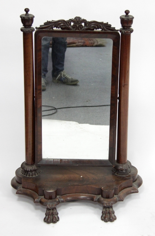 A Victorian mahogany swing frame toilet mirror, the rectangular plate on column supports to a shaped