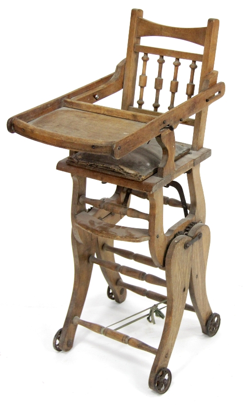 A child's early 20th Century metamorphic high chair, converting to a rocking chair