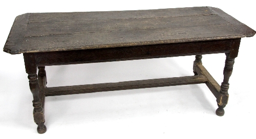 An oak and elm refectory table, the three-plank top on turned legs with H-stretchers, 167cm (65.75")