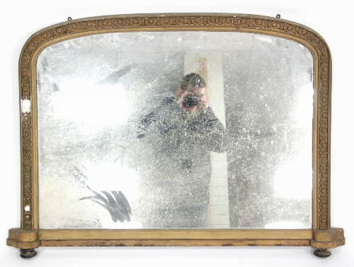 A Victorian overmantel mirror, the arch glass in a gilt frame, the glass 64cm x 89cm (25" x 34.5")