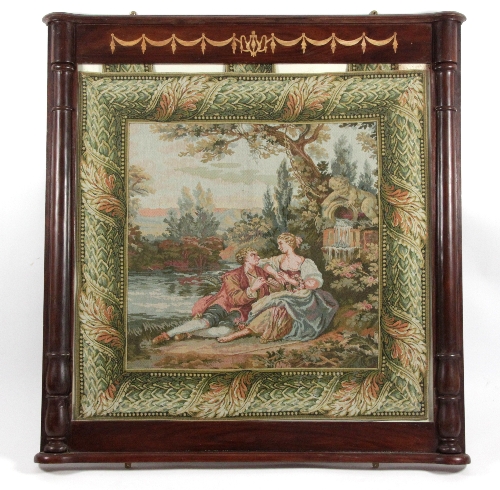 A frame with inlaid swags to the frieze and pilasters to the sides, containing a tapestry panel,