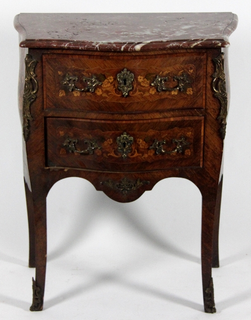 A Louis XV style serpentine two-drawer commode with rouge marble top, the drawers and sides inlaid