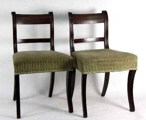 A set of five Regency dining chairs, with chequer strung splats to moulded frames, on sabre legs