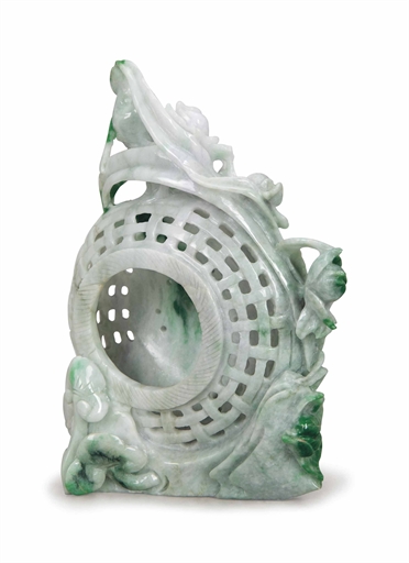 A CHINESE CARVED JADEITE MODEL OF A BASKET, 
the reticulated basket surrounded by blossoms, branches