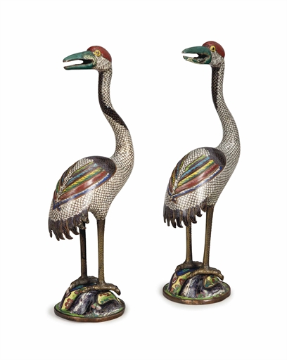 A PAIR OF SMALL CHINESE CLOISONNE ENAMEL STANDING FIGURES OF CRANES ON STANDS,
11¼in. (28.5cm.) high