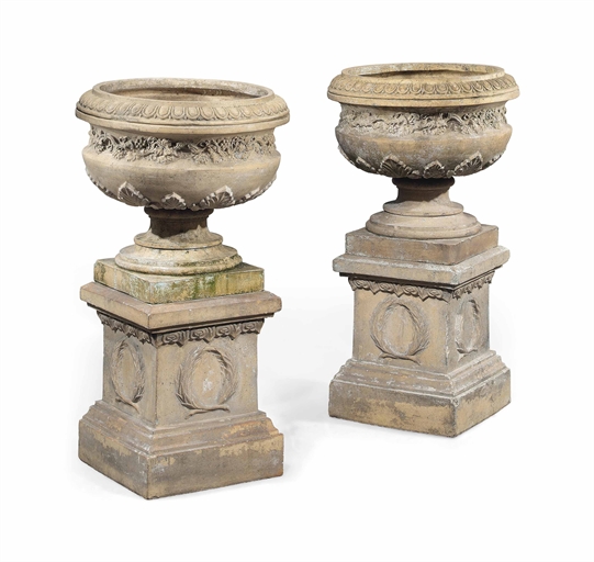 A PAIR OF SCOTTISH TERRACOTTA GARDEN URNS ON PLINTHS
LATE 19TH CENTURY BY FULTON OF KILWINNING