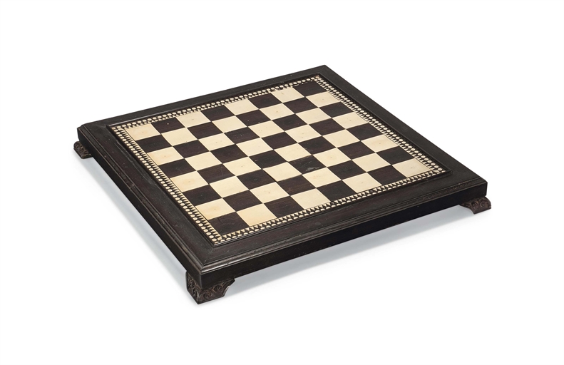 AN ANGLO-INDIAN IVORY INLAID EBONY GAMES BOARD
LATE 19TH CENTURY
With a dot and triangle border,