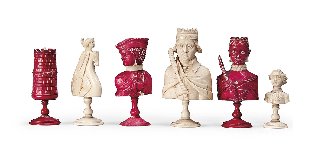 A FRENCH CARVED IVORY BUST TYPE CHESS SET
DIEPPE, EARLY 19TH CENTURY
Modelled as the Europeans