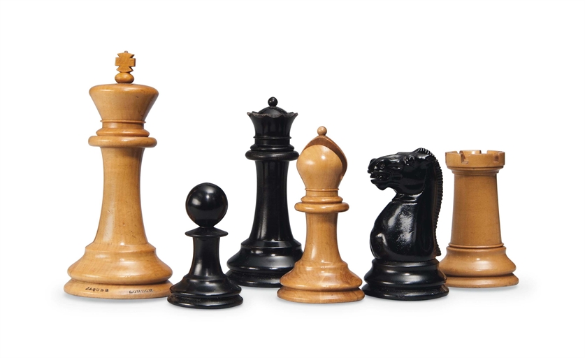 A VICTORIAN BOXWOOD AND EBONISED WEIGHTED CLUB SIZE STAUNTON CHESS SET
BY JAQUES & SON, LONDON,