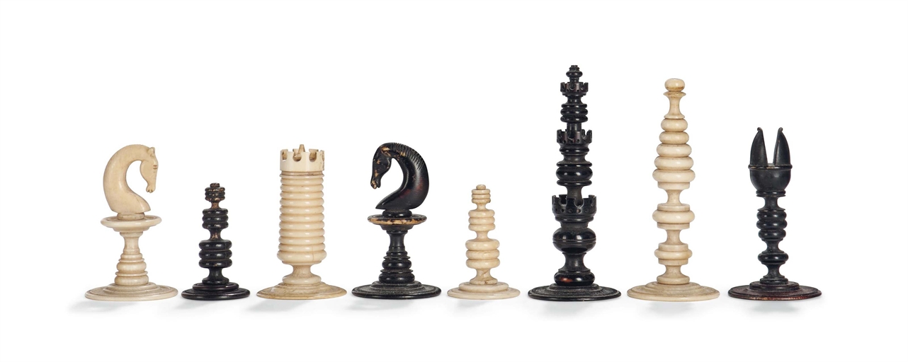 A NORTH EUROPEAN IVORY CHESS SET
18TH CENTURY
Stained and natural, with concentrically turned stems,