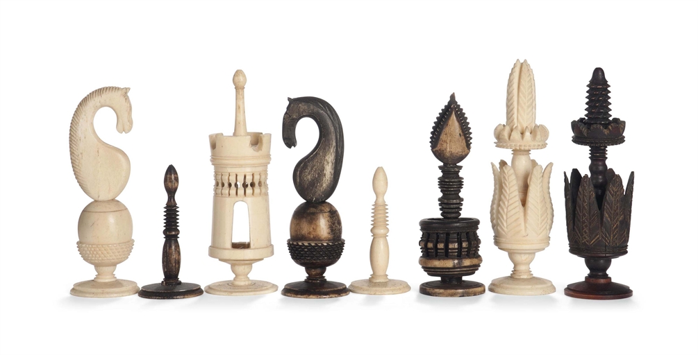 A CARVED AND TURNED BONE 'SPANISH PULPIT' TYPE CHESS SET
The kings and queens modelled with stiff