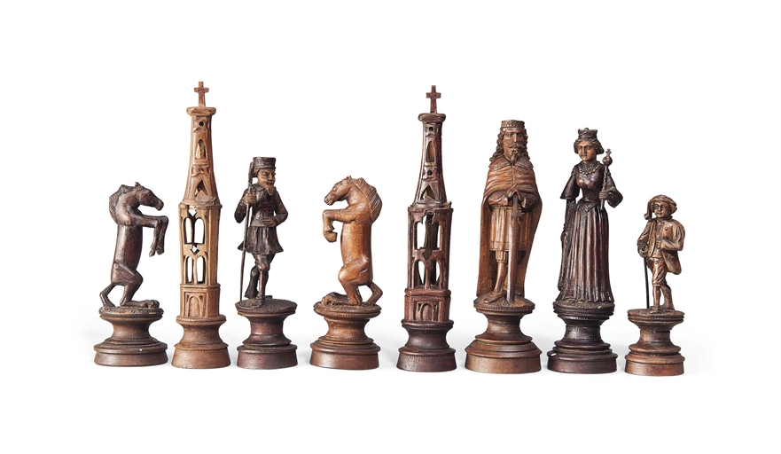 A GERMAN SOFTWOOD FIGURAL CHESS SET
EARLY 20TH CENTURY
The kings possibly depicting Charlemagne
