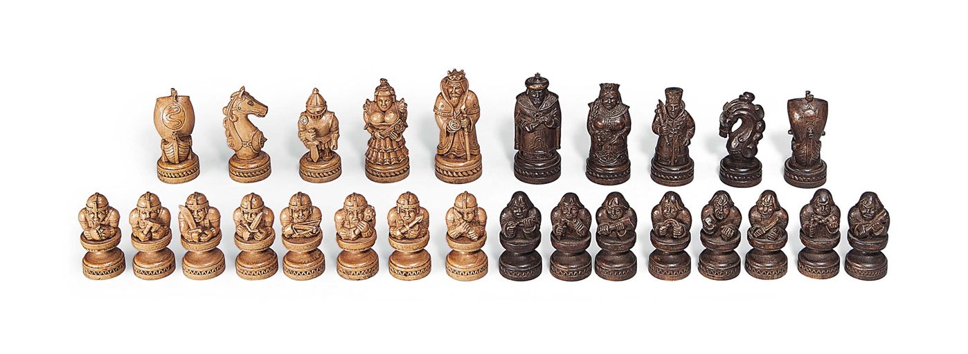 A RUSSIAN CARVED WOOD FIGURAL CHESS SET
LATE 19TH / EARLY 20TH CENTURY
Modelled as Russian versus