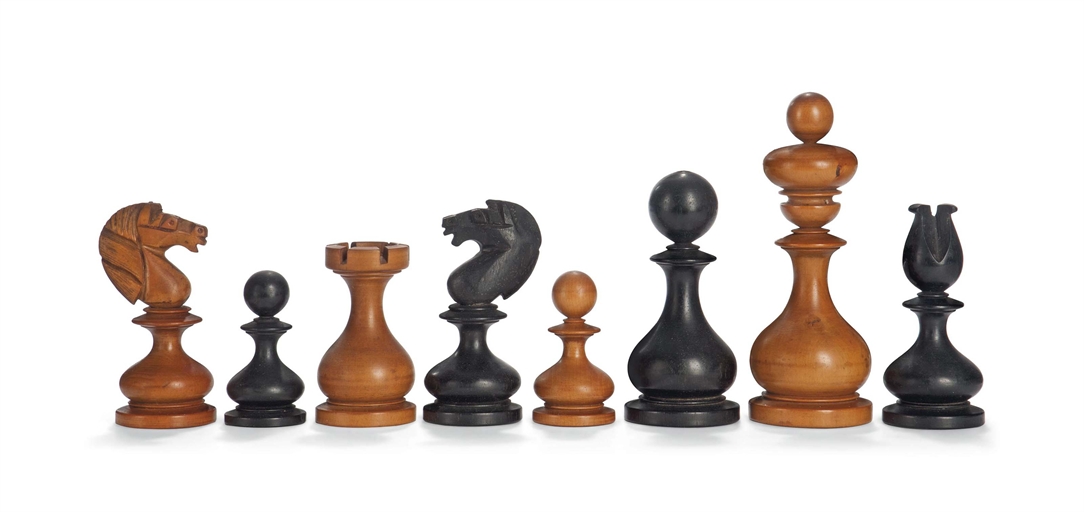 A VICTORIAN BOXWOOD AND EBONY DUBLIN PATTERN CHESS SET
MID-19TH CENTURY
The white king with ink