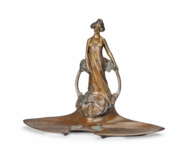 A CHARLES KORSCHANN (1872-1943) PATINATED FIGURAL BRONZE INKWELL AND PENTRAY
CIRCA 1900 
Modelled