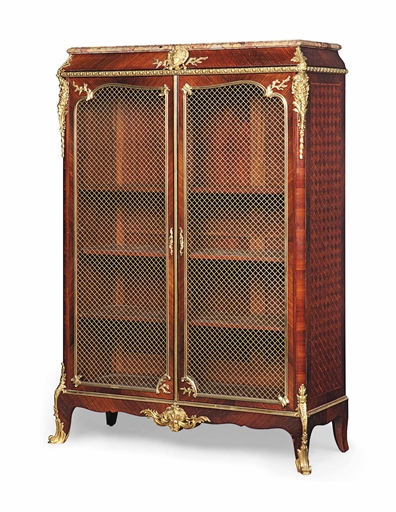 A FRENCH ORMOLU-MOUNTED KINGWOOD, BOIS SATINE AND TULIPWOOD BIBLIOTHEQUE
OF EARLY LOUIS XV STYLE,