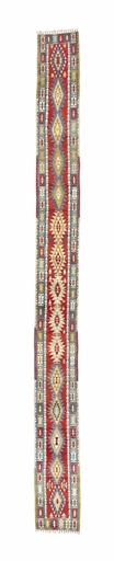 A VERY LONG & UNUSUAL KILIM RUNNER, TURKEY 
SECOND HALF OF 20TH CENTURY 
approx: 31ft.1in. x 2ft.