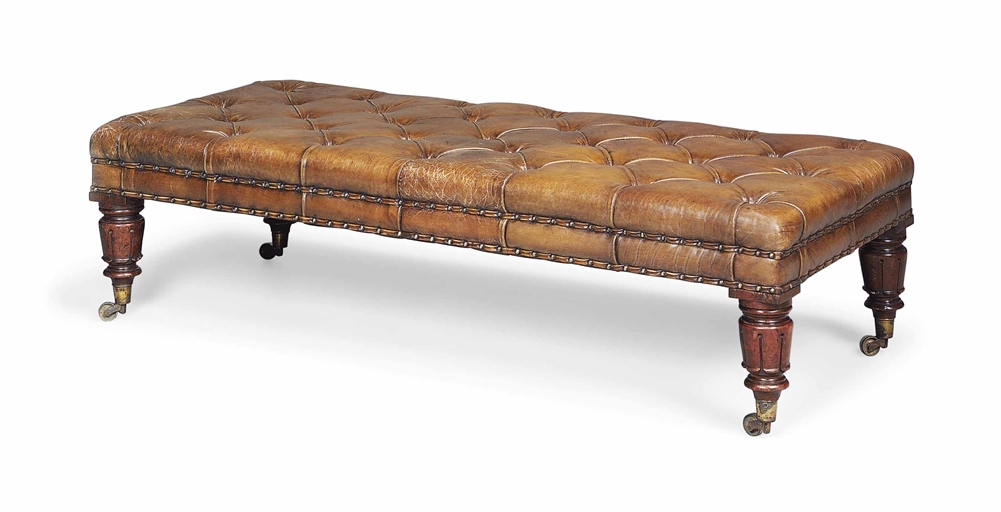 A MAHOGANY BUTTONED LEATHER LONG STOOL 
MID-19TH CENTURY, ADAPTED 
Covered in brown leather on